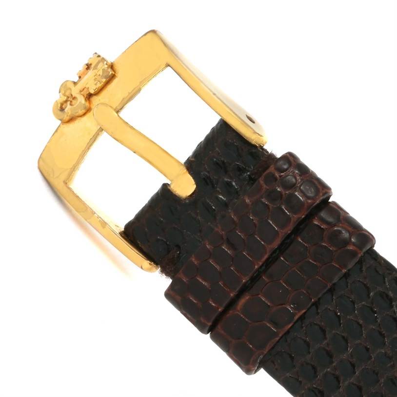 The image shows a close-up of the buckle and strap of a Corum Coin Watch Men's Yellow Gold Black Dial Men's Yellow Gold Black Dial model.