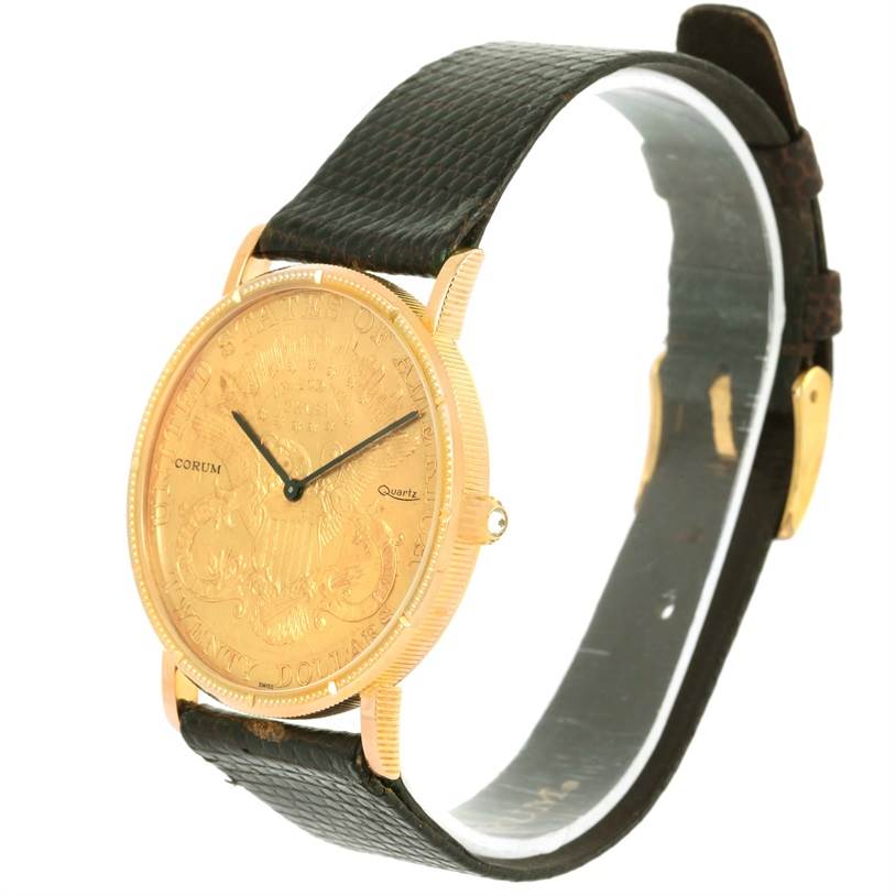 The image shows a Corum Coin Watch Men's Yellow Gold Black Dial Men's Yellow Gold Black Dial model at a slight angle, displaying its gold-toned dial, case, and black leather strap.