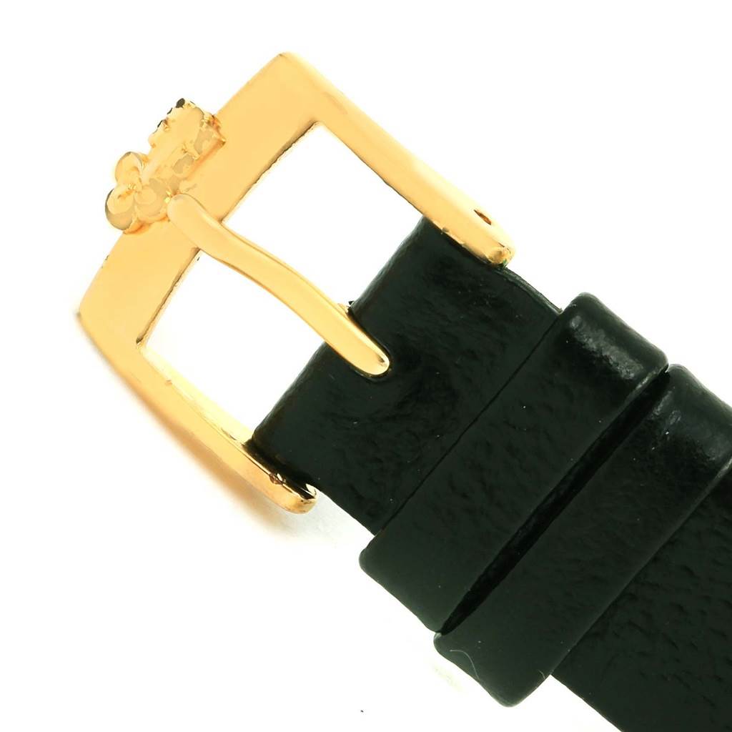 This image shows the gold buckle and black leather strap of the Corum Women's Yellow Gold Black Dial Women's Yellow Gold Black Dial 18K Yellow Gold 10 Dollars Coin Ladies Watch Box Papers model.