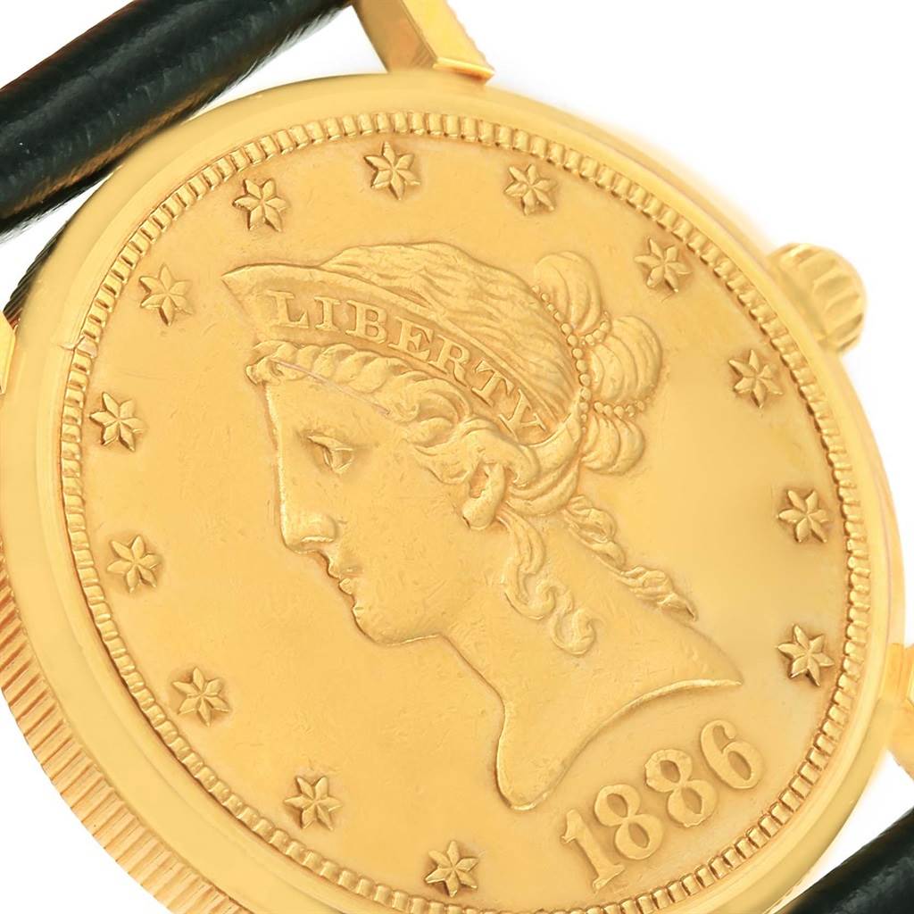 The image shows a close-up of the watch face featuring the coin design on the Corum Women's Yellow Gold Black Dial Women's Yellow Gold Black Dial 18K Yellow Gold 10 Dollars Coin Ladies Watch.