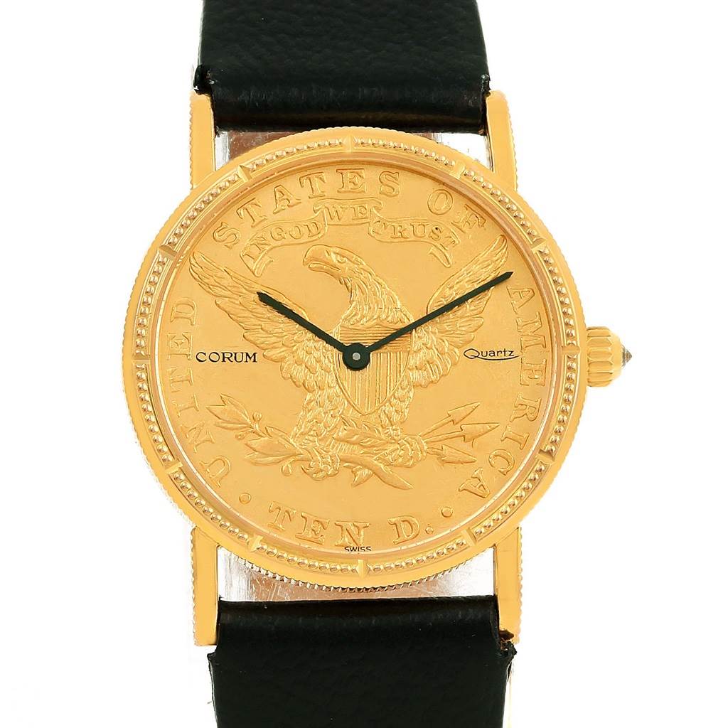 The image shows a front view of the Corum Women's Yellow Gold Black Dial Women's Yellow Gold Black Dial 18K Yellow Gold 10 Dollars Coin Ladies Watch, highlighting the detailed coin dial and black strap.