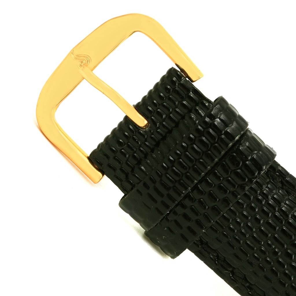 This image shows the black strap and gold buckle of a Corum Coin Watch Men's Yellow Gold Black Dial Men's Yellow Gold Black Dial model.