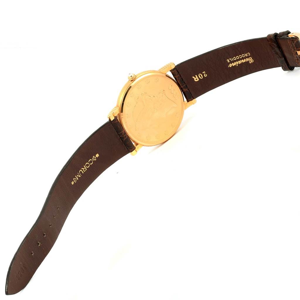 This image shows a Corum Coin Watch Men's Yellow Gold Black Dial Men's Yellow Gold Black Dial model focusing on the back of the watch and the brown leather strap.