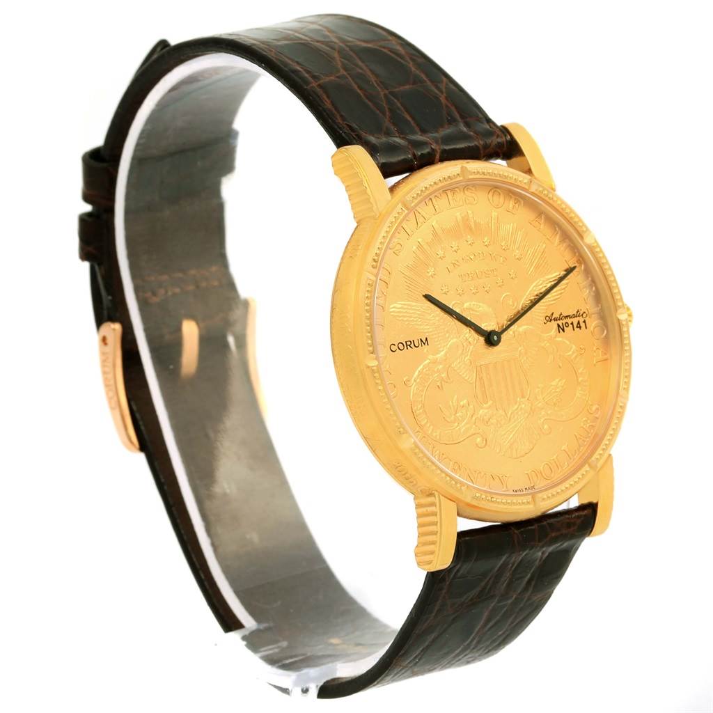 The image shows a side angle of the Corum Coin Watch Men's Yellow Gold Black Dial Men's Yellow Gold Black Dial model, highlighting its gold face and black leather strap.