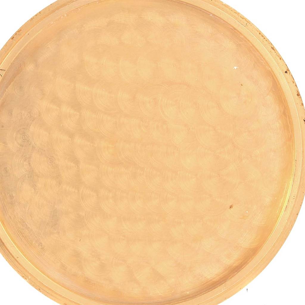 This image shows a close-up of the back cover of the Corum Coin Watch Men's Yellow Gold Black Dial Men's Yellow Gold Black Dial model.