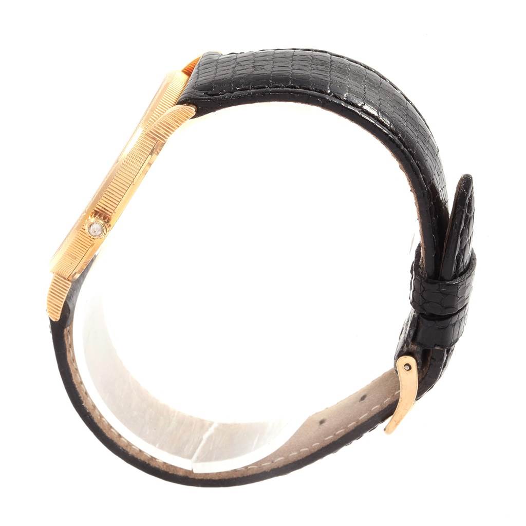 The image shows a side view of the Corum Yellow Gold Black Dial Yellow Gold Black Dial 20 Dollars Double Eagle Yellow Gold Coin Year 1880 Watch, featuring its gold case and black strap.