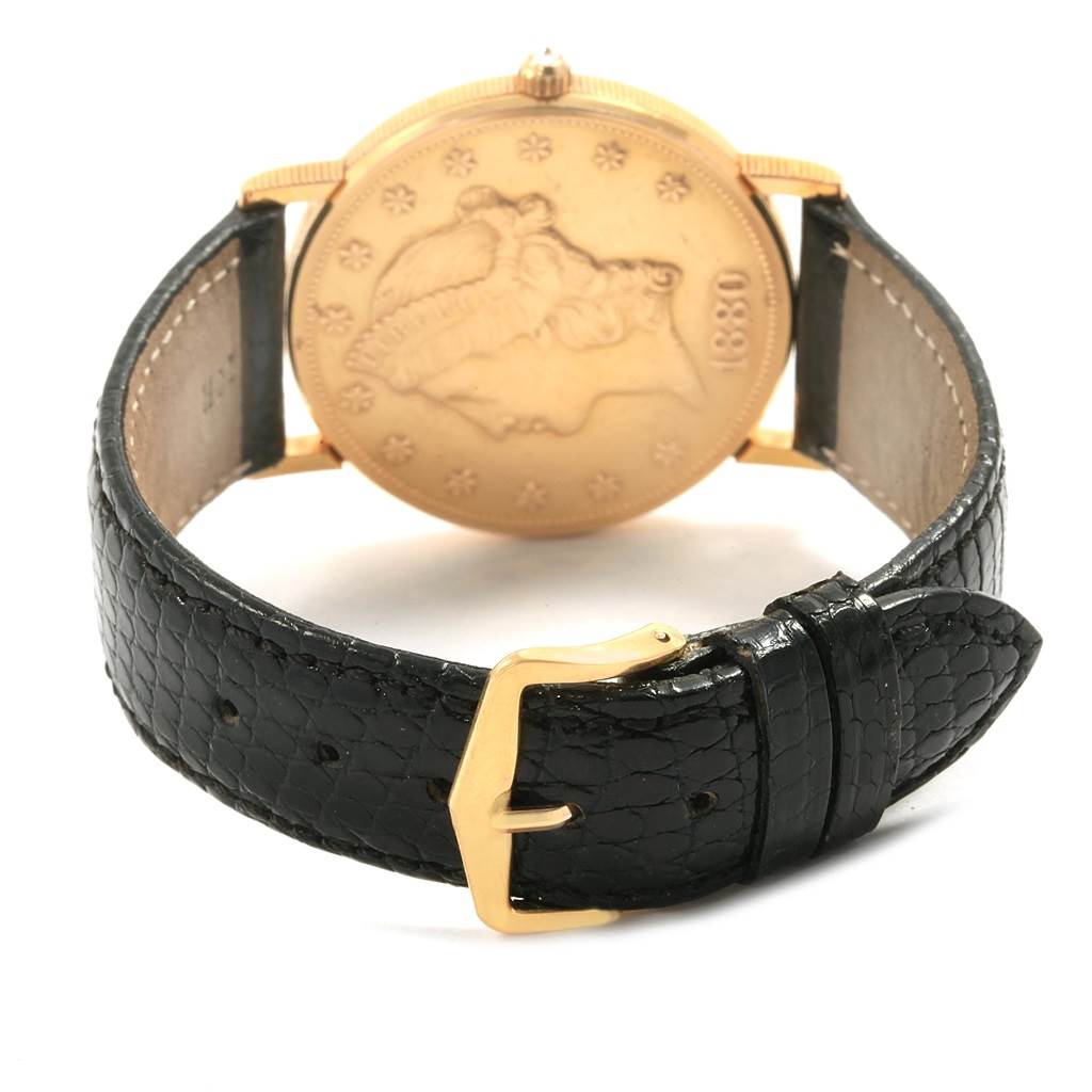 The image shows the back view of a Corum Yellow Gold Black Dial Yellow Gold Black Dial 20 Dollars Double Eagle Yellow Gold Coin Year 1880 Watch, highlighting the coin design and leather strap.