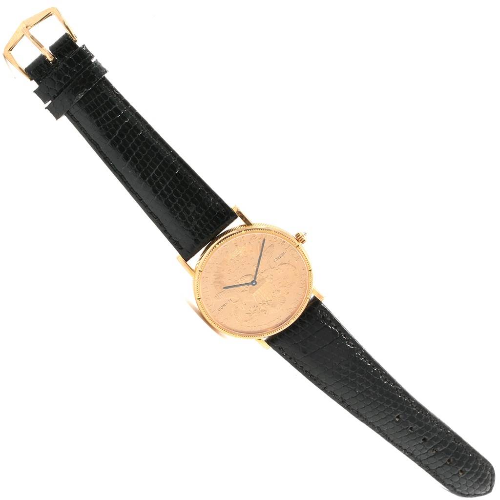 The image shows a top-down angle of the Corum Yellow Gold Black Dial Yellow Gold Black Dial 20 Dollars Double Eagle Yellow Gold Coin Year 1880 Watch with a black leather strap.