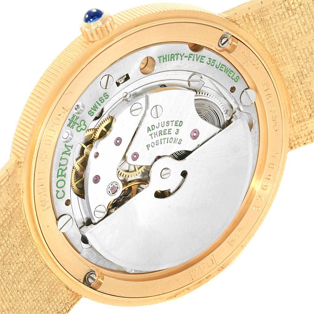 The image shows the back view of the Corum Coin Watch Men's Yellow Gold Black Dial Men's Yellow Gold Black Dial model, displaying its internal mechanical movement components.