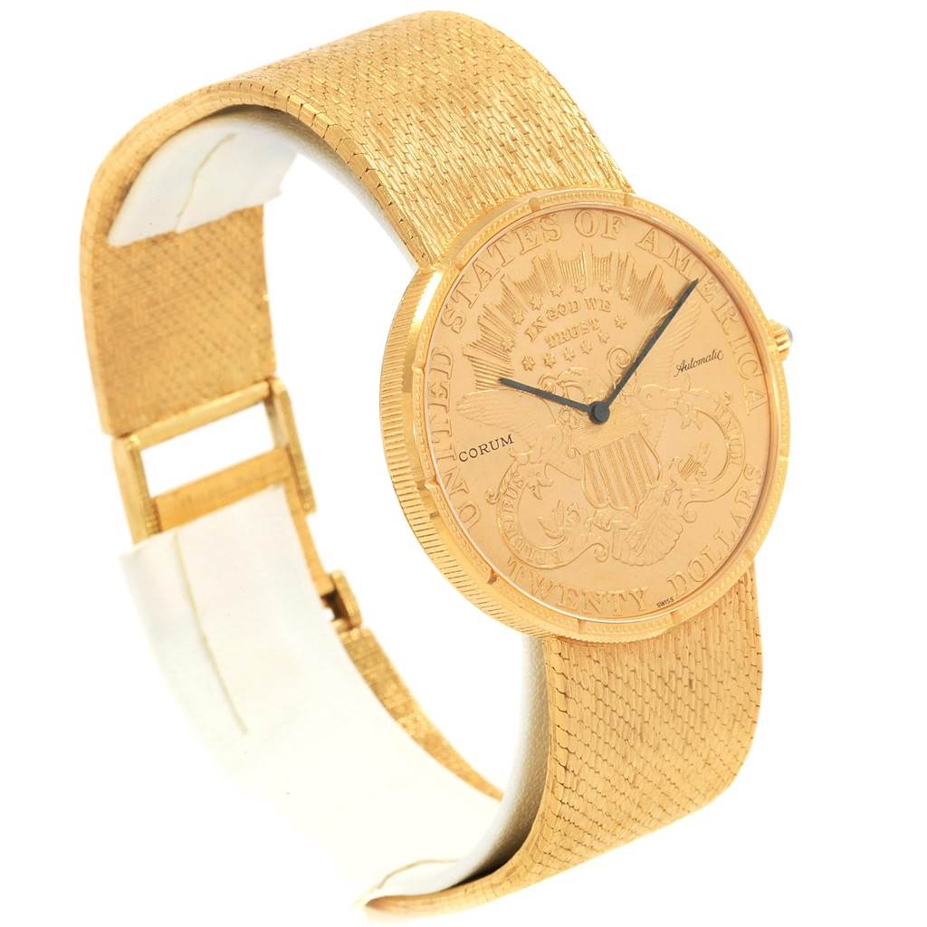 The Corum Coin Watch Men's Yellow Gold Black Dial Men's Yellow Gold Black Dial model is shown at a three-quarter angle highlighting the face, band, and clasp.