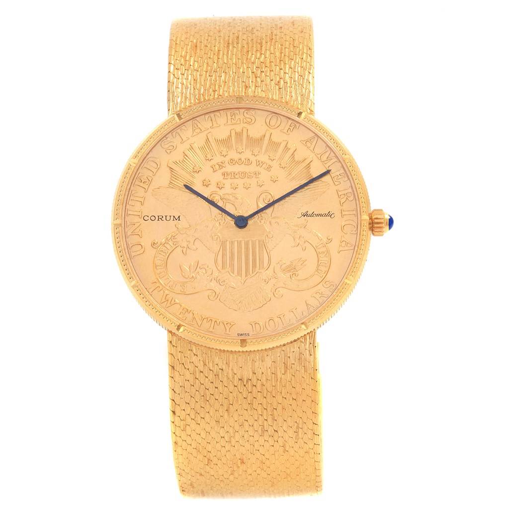 The Corum Coin Watch Men's Yellow Gold Black Dial Men's Yellow Gold Black Dial model is shown from a front angle, displaying the detailed face and gold mesh bracelet.