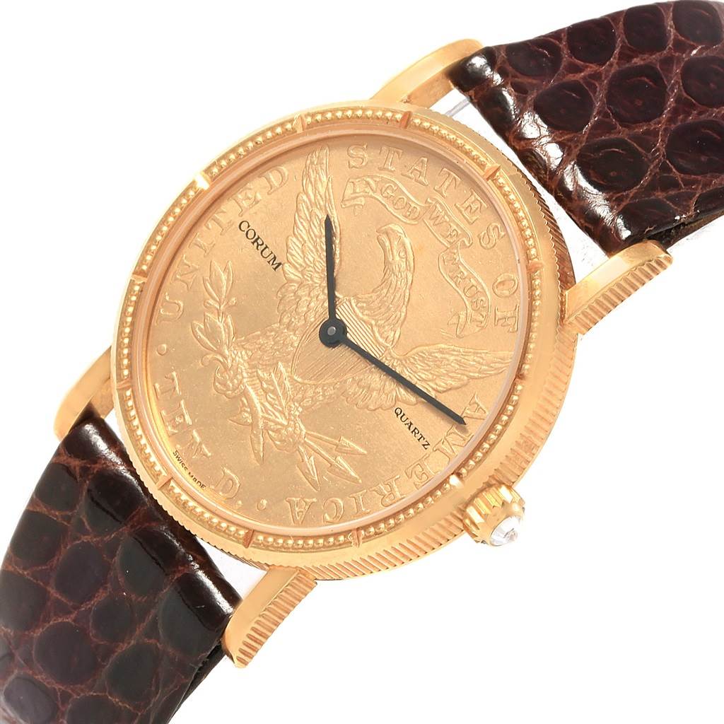 The image shows a close-up, front angle of the Corum  Women's Yellow Gold Black Dial  Women's Yellow Gold Black Dial Yellow Gold 10 Dollars Coin Diamond Ladies Watch Year 1881, displaying its face and part of the strap.