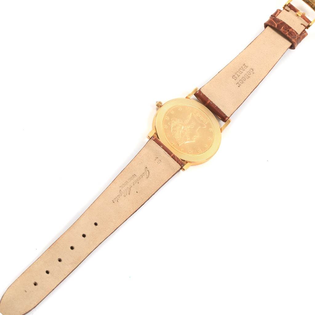 The image shows a Corum Women's Yellow Gold Black Dial Women's Yellow Gold Black Dial Yellow Gold 10 Dollars Coin Diamond Ladies Watch Year 1882 laid flat, displaying the watch face and leather straps from a top view.