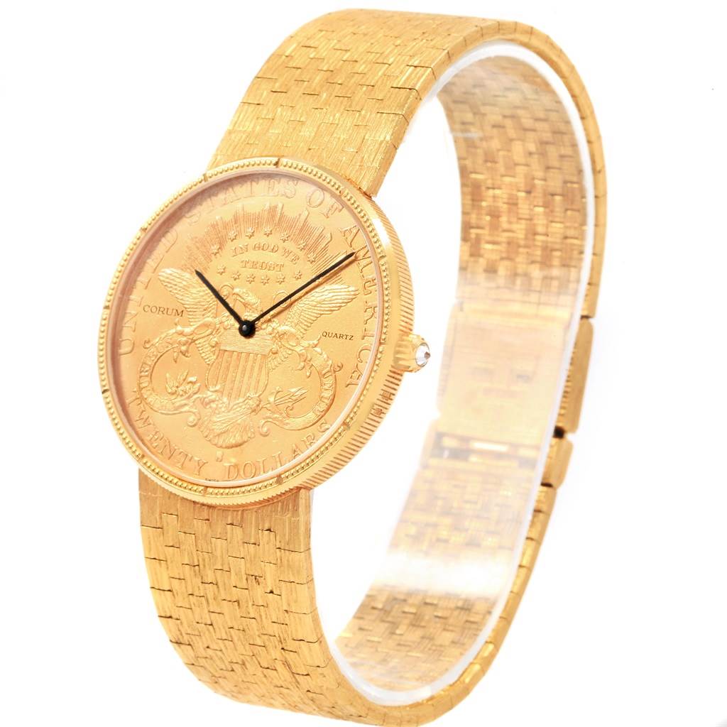 The image displays a Corum Coin Watch Men's Yellow Gold Black Dial Men's Yellow Gold Black Dial model from a three-quarter angle, showing the dial, bezel, crown, and bracelet.