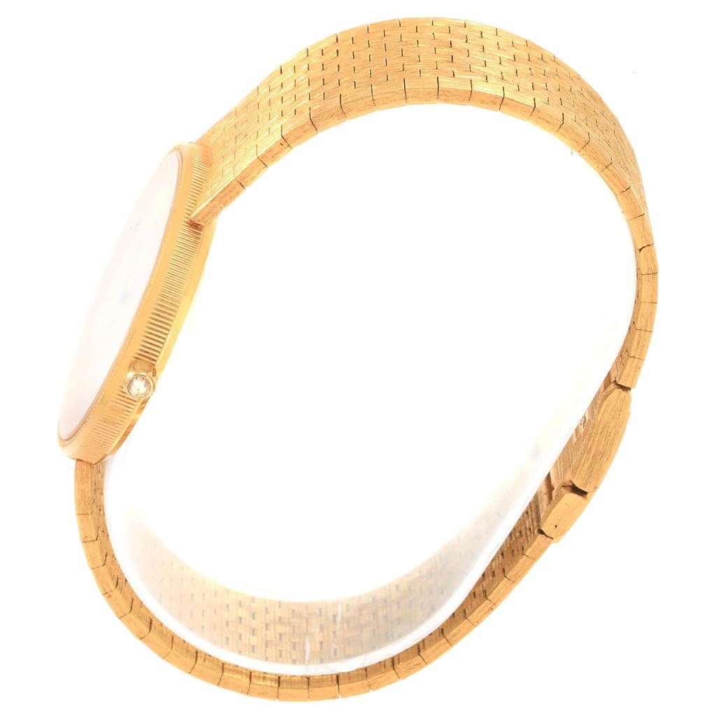 The image shows a side view of a Corum Coin Watch Men's Yellow Gold Black Dial Men's Yellow Gold Black Dial model, highlighting its band and profile.