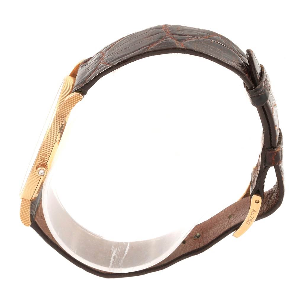 The image shows a side profile of the Corum Coin Watch  Men's Yellow Gold Black Dial  Men's Yellow Gold Black Dial model, highlighting the band, case, and clasp.