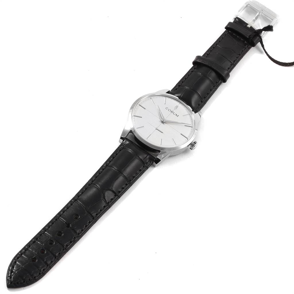 This is a top-angle view of a Corum Heritage V157/02614 Men's Stainless Steel Silver Dial V157/02614 Men's Stainless Steel Silver Dial model watch showing its black leather strap, silver dial, and case.