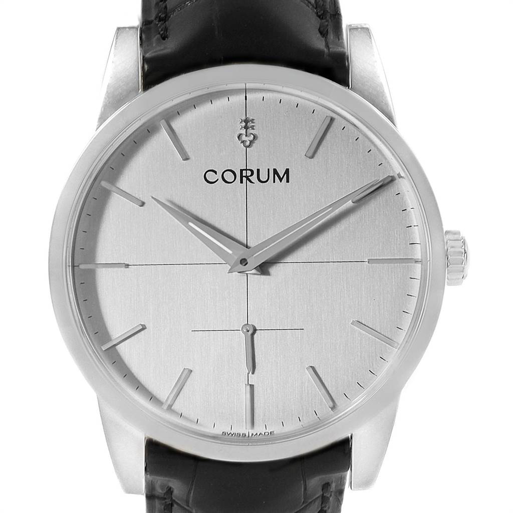 The image shows a front view of the Corum Heritage V157/02614 Men's Stainless Steel Silver Dial V157/02614 Men's Stainless Steel Silver Dial watch, displaying the dial, hands, crown, and part of the leather strap.