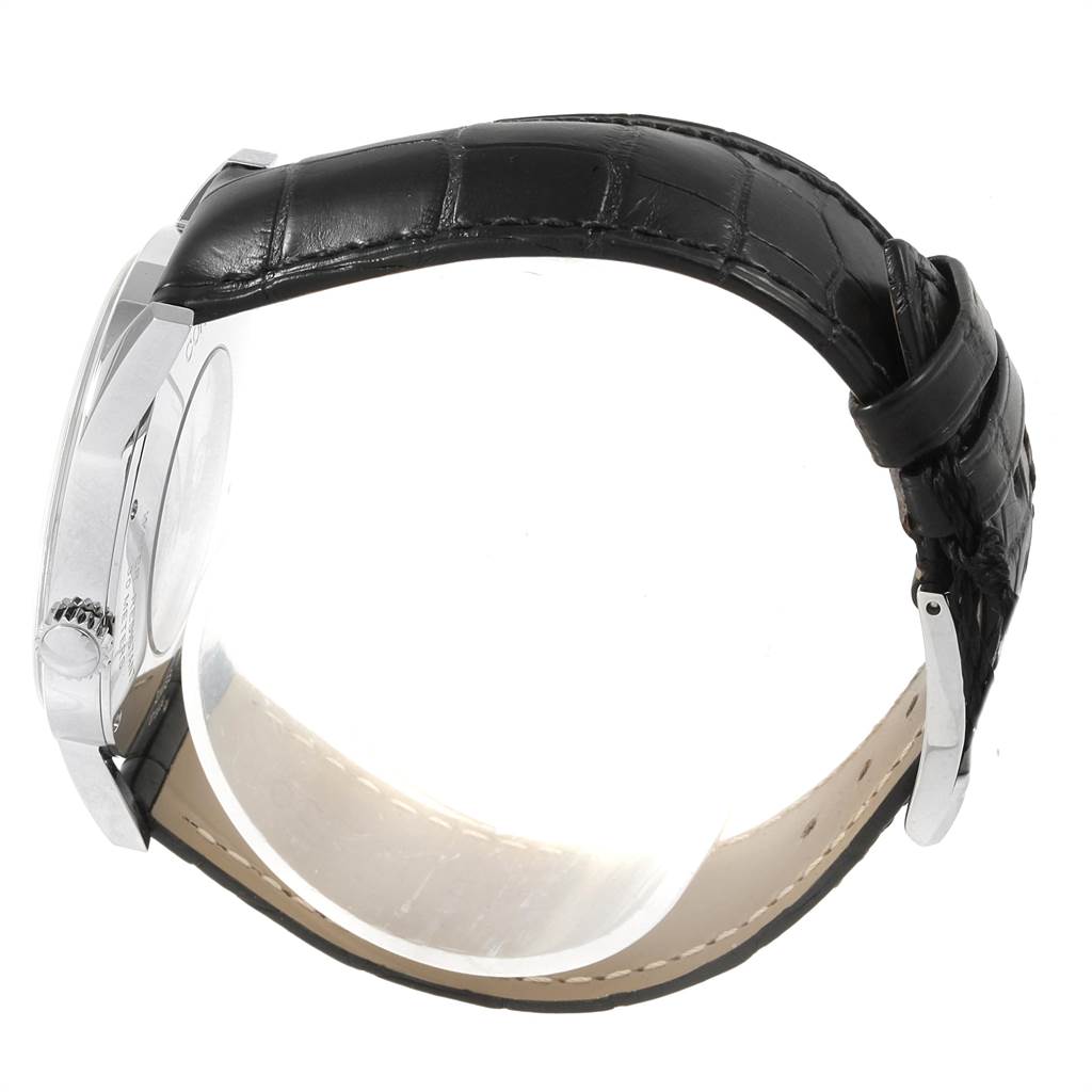 This is a side view of the Corum Heritage V157/02614 Men's Stainless Steel Silver Dial V157/02614 Men's Stainless Steel Silver Dial model watch, featuring the case, crown, and black leather strap.