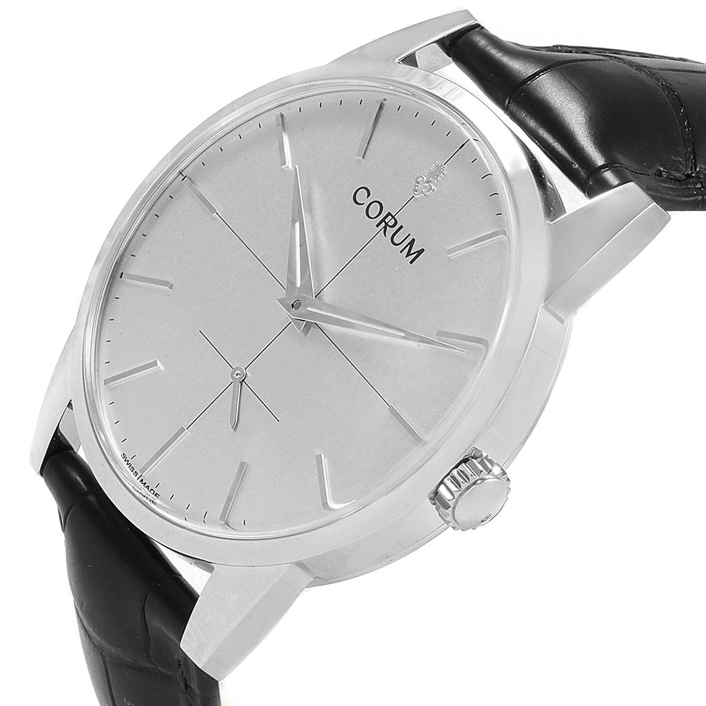 This image shows a Corum Heritage V157/02614 Men's Stainless Steel Silver Dial V157/02614 Men's Stainless Steel Silver Dial watch at an angle, highlighting the dial, crown, and leather strap.