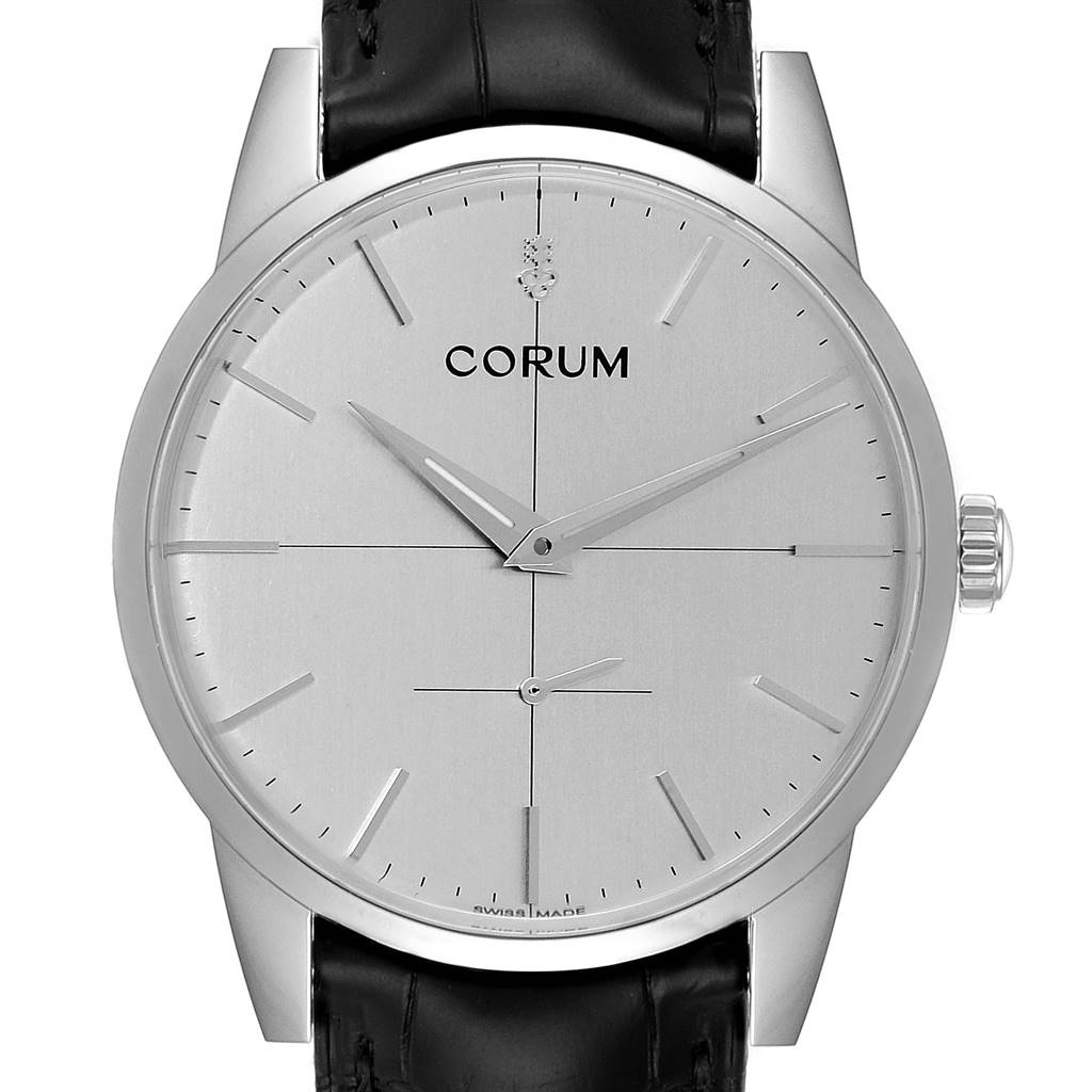 The image shows a front view of the Corum Heritage V157/02614 Men's Stainless Steel Silver Dial V157/02614 Men's Stainless Steel Silver Dial model watch, highlighting its dial, hands, crown, and part of the leather strap.