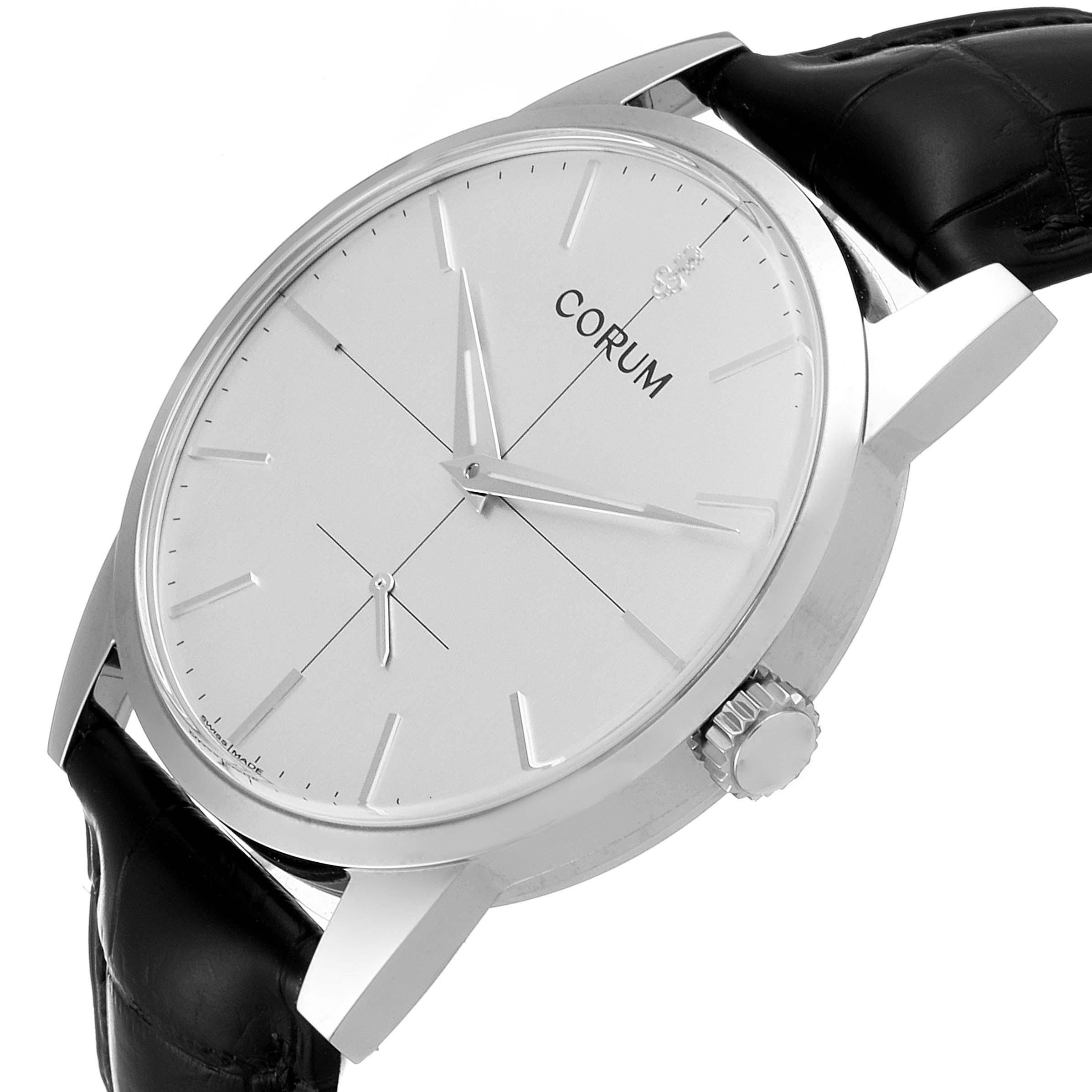 The image shows a Corum Heritage V157/02614 Men's Stainless Steel Silver Dial V157/02614 Men's Stainless Steel Silver Dial watch at an oblique angle highlighting the face, crown, and part of the black leather strap.