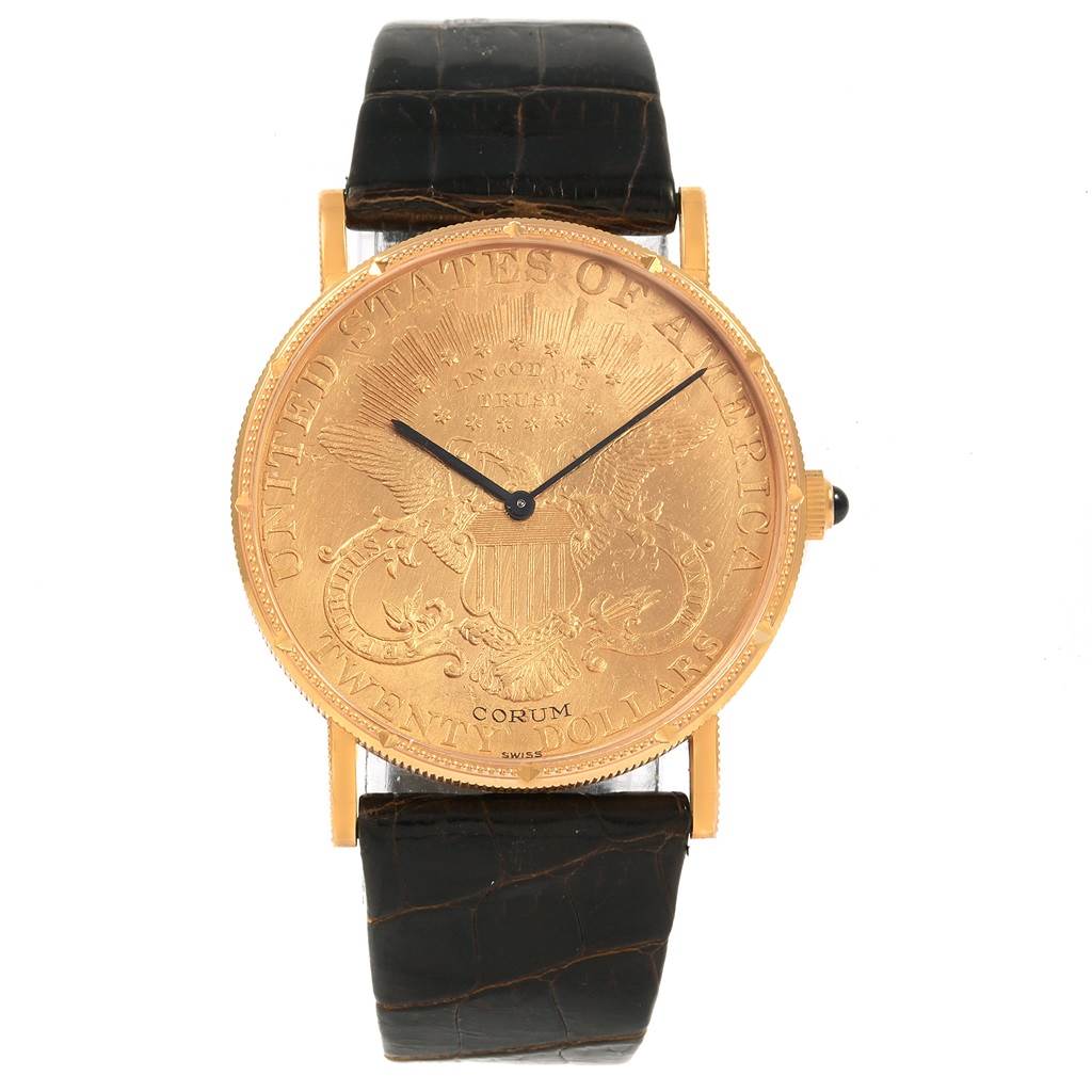 The image shows a front view of the Corum Coin Watch Men's Yellow Gold Black Dial Men's Yellow Gold Black Dial model with its gold-toned dial and black leather strap.