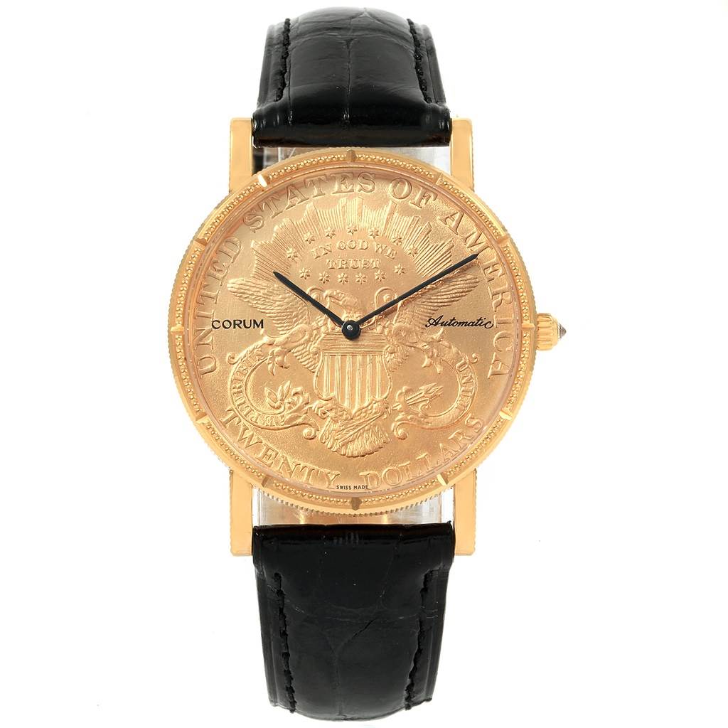 This image shows a frontal view of the Corum Coin Watch Men's Yellow Gold Black Dial Men's Yellow Gold Black Dial model, featuring its gold coin dial and black leather strap.