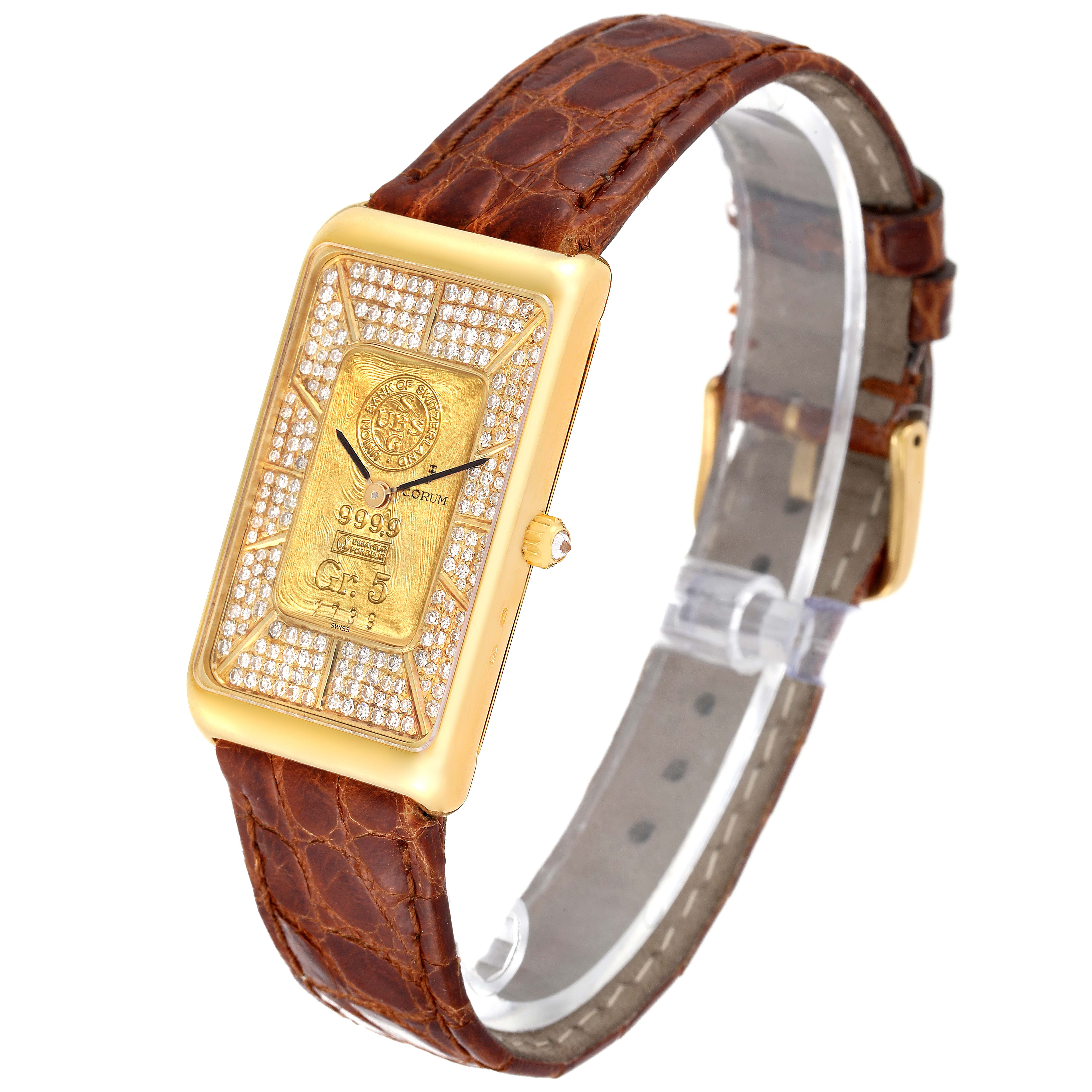 The Corum 55400 Women's Yellow Gold Champagne Dial 55400 Women's Yellow Gold Champagne Dial 5 Gram Ingot Yellow Gold Diamond Ladies Watch 55400 is shown at an angle displaying the face and brown leather strap.