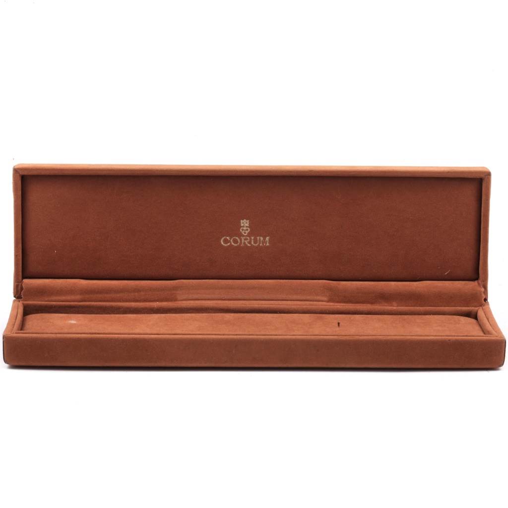 The image shows an open Corum 55400 Women's Yellow Gold Champagne Dial 55400 Women's Yellow Gold Champagne Dial watch box for the 5 Gram Ingot Yellow Gold Diamond Ladies Watch 55400 model.