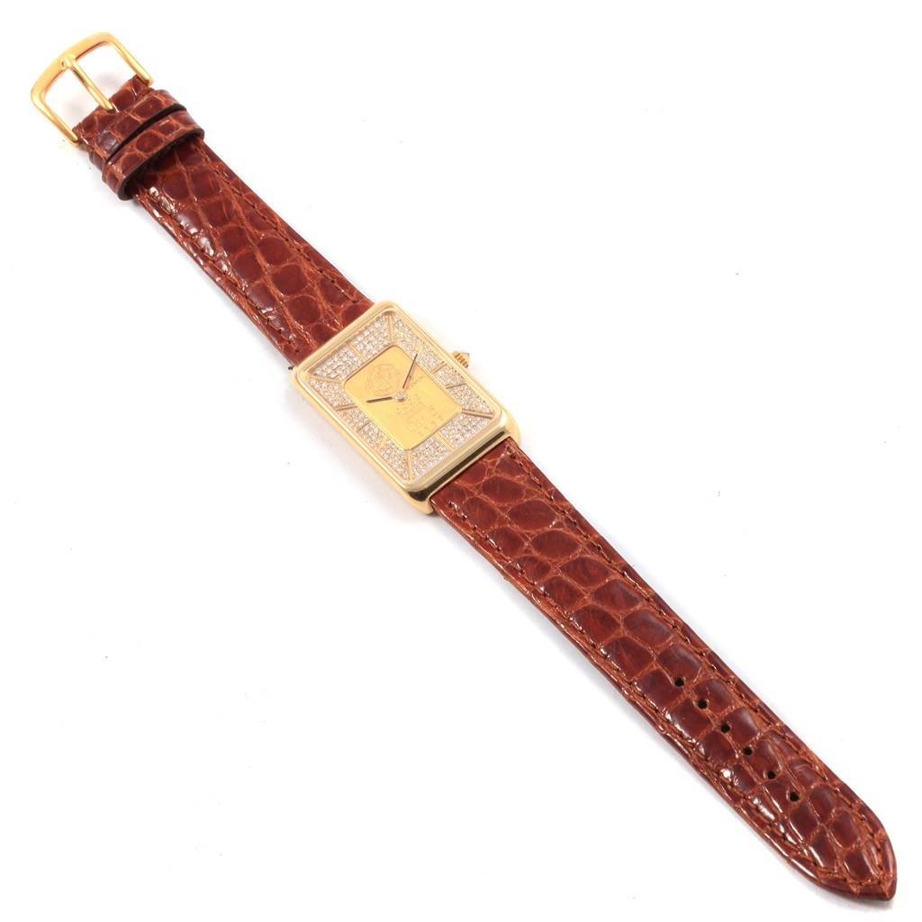 The image shows a top-down view of the Corum 55400 Women's Yellow Gold Champagne Dial 55400 Women's Yellow Gold Champagne Dial 5 Gram Ingot Yellow Gold Diamond Ladies Watch 55400 with a brown leather strap.