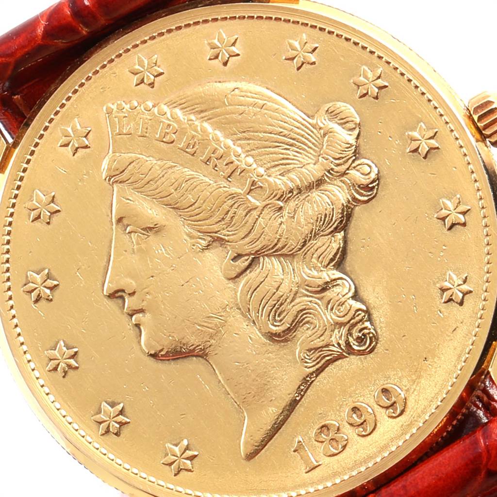 The image shows a close-up of the dial on the Corum Coin Watch Men's Yellow Gold Black Dial Men's Yellow Gold Black Dial model, including the coin face and partial strap.