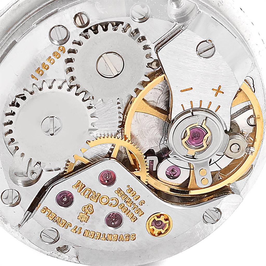 The image shows an up-close view of the movement mechanism of the Corum 80358 Women's White Gold Silver Dial 80358 Women's White Gold Silver Dial 18K White Gold Diamond Vintage Cocktail Ladies Watch.