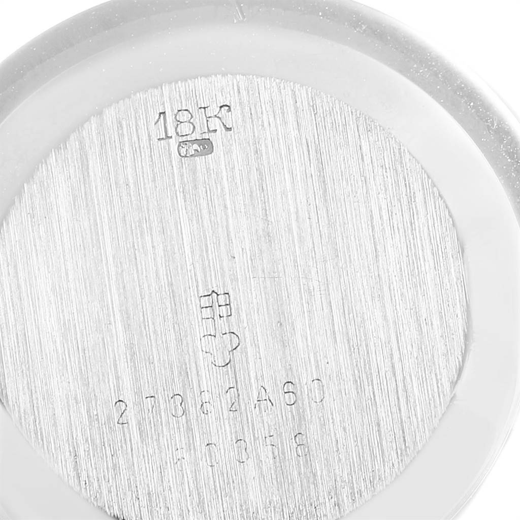 This image shows the backside of the Corum 80358 Women's White Gold Silver Dial 80358 Women's White Gold Silver Dial 18K White Gold Diamond Vintage Cocktail Ladies Watch, highlighting the material and serial number.