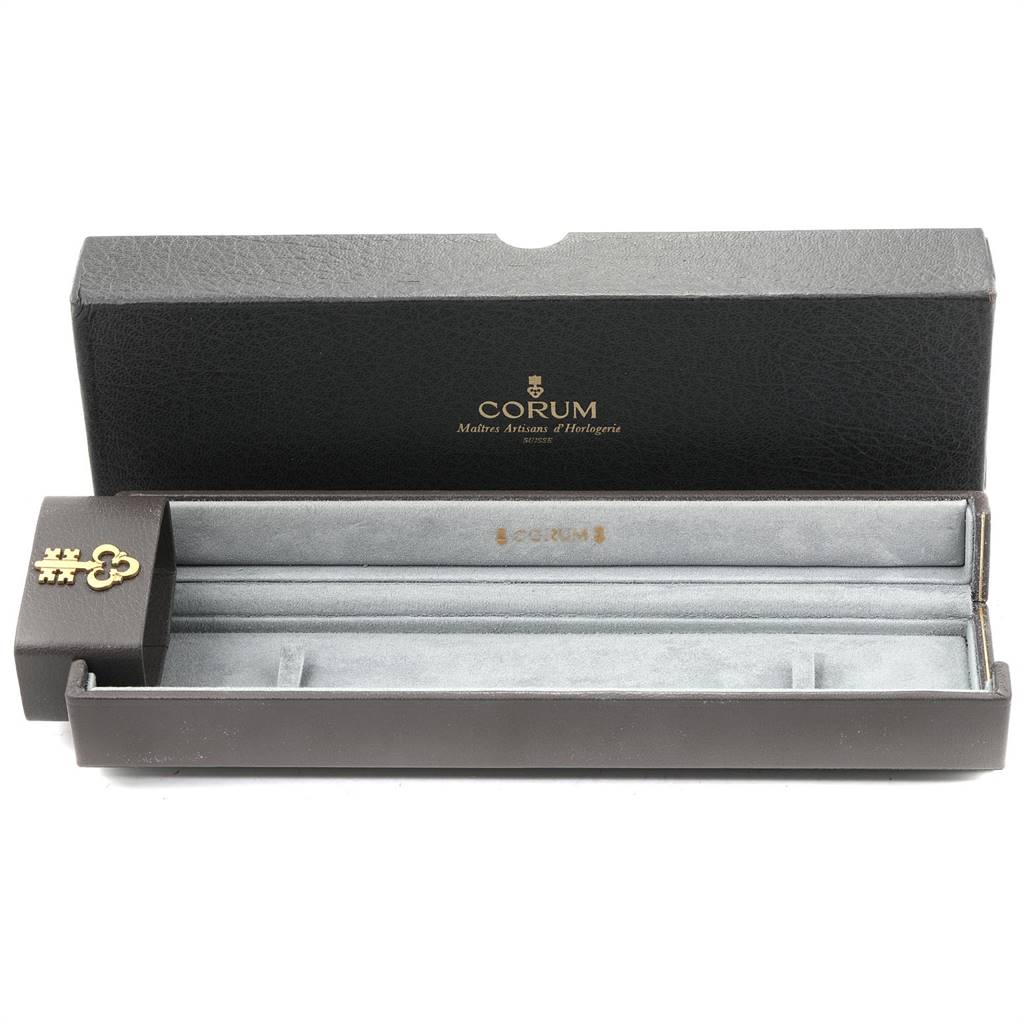 This image shows an empty watch box for a Corum Coin Watch Men's Yellow Gold Black Dial Men's Yellow Gold Black Dial model, displayed from the front.