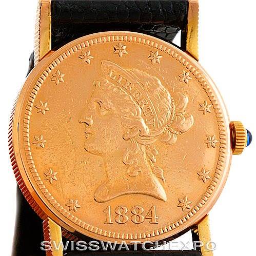 This image shows a front view of the Corum Women's Yellow Gold Black Dial Women's Yellow Gold Black Dial Vintage Ladies 18K Yellow Gold 10 Dollars Coin Watch, highlighting its intricate coin dial and crown.