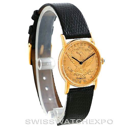The image shows a side angle of the Corum Women's Yellow Gold Black Dial Women's Yellow Gold Black Dial Vintage Ladies 18K Yellow Gold 10 Dollars Coin Watch with a black leather strap and gold dial.