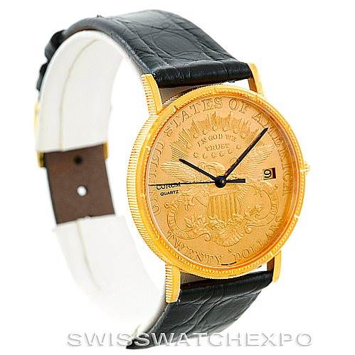 The image shows a Corum Coin Watch Men's Yellow Gold Black Dial Men's Yellow Gold Black Dial model at a three-quarter angle, highlighting its gold coin face, black leather strap, and date window.