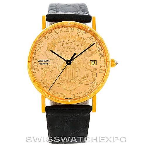 The image shows a front view of the Corum Coin Watch Men's Yellow Gold Black Dial Men's Yellow Gold Black Dial model, displaying the dial, hands, date window, and leather strap.