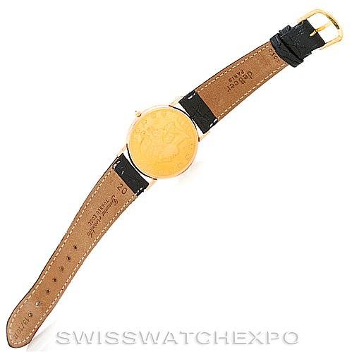 This image shows the back view of a Vintage Corum watch with a brown leather strap and visible caseback.