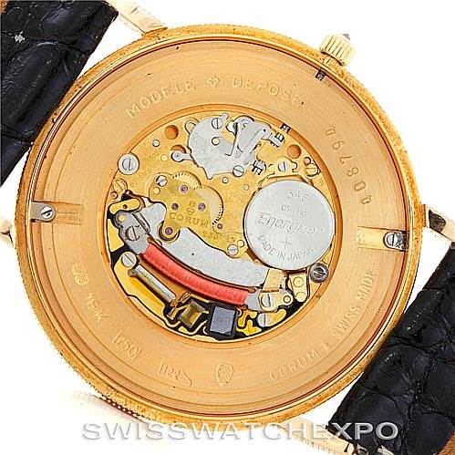 The image shows the internal mechanism and movement of a Vintage Corum watch, viewed from the back.