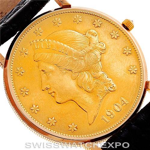 The image shows a close-up of a Corum Vintage watch, highlighting its gold coin face and part of the leather strap.