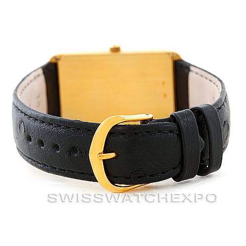 The image shows the back view of a Vintage Corum watch, highlighting its clasp and black leather strap.