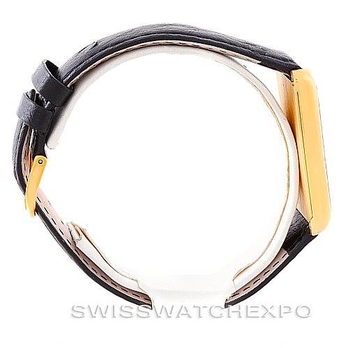 This image shows a side view of the Corum Vintage Men's Yellow Gold Champagne Dial Men's Yellow Gold Champagne Dial watch, highlighting its case, crown, and leather strap.