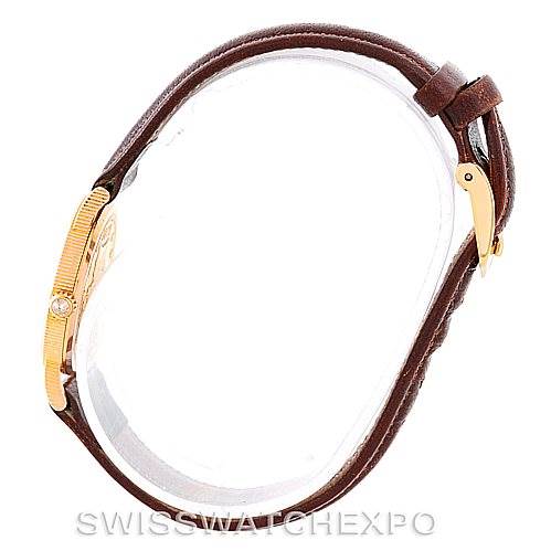 Side view of the Corum Women's Yellow Gold Black Dial Women's Yellow Gold Black Dial Vintage Ladies 18K Yellow Gold 5 Dollars Coin Watch, showcasing the bezel and leather strap.