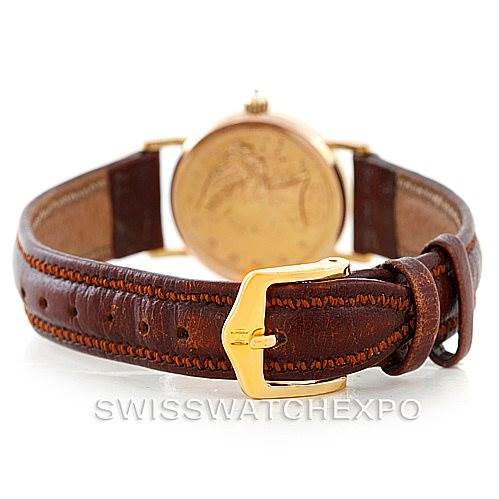 The image shows the rear view of the Corum Women's Yellow Gold Black Dial Women's Yellow Gold Black Dial Vintage Ladies 18K Yellow Gold 5 Dollars Coin Watch, highlighting the leather strap and buckle.