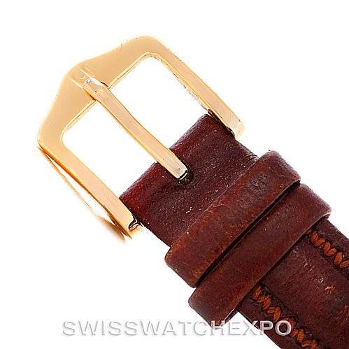 This image shows the buckle and part of the leather strap of the Corum Women's Yellow Gold Black Dial Women's Yellow Gold Black Dial Vintage Ladies 18K Yellow Gold 5 Dollars Coin Watch from a close-up angle.