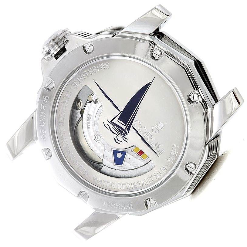 The image shows the back of the Corum Admirals Cup 982.630.20 Men
s Stainless Steel Silver Dial 982.630.20 Men
s Stainless Steel Silver Dial watch, highlighting the case back and inner mechanics with nautical-themed engravings.