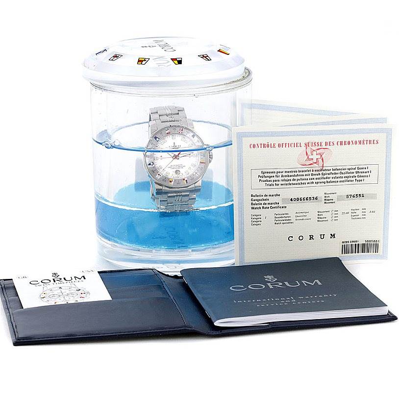 The image shows the Corum Admiral
s Cup watch, its certificate, and manuals from a front angle.