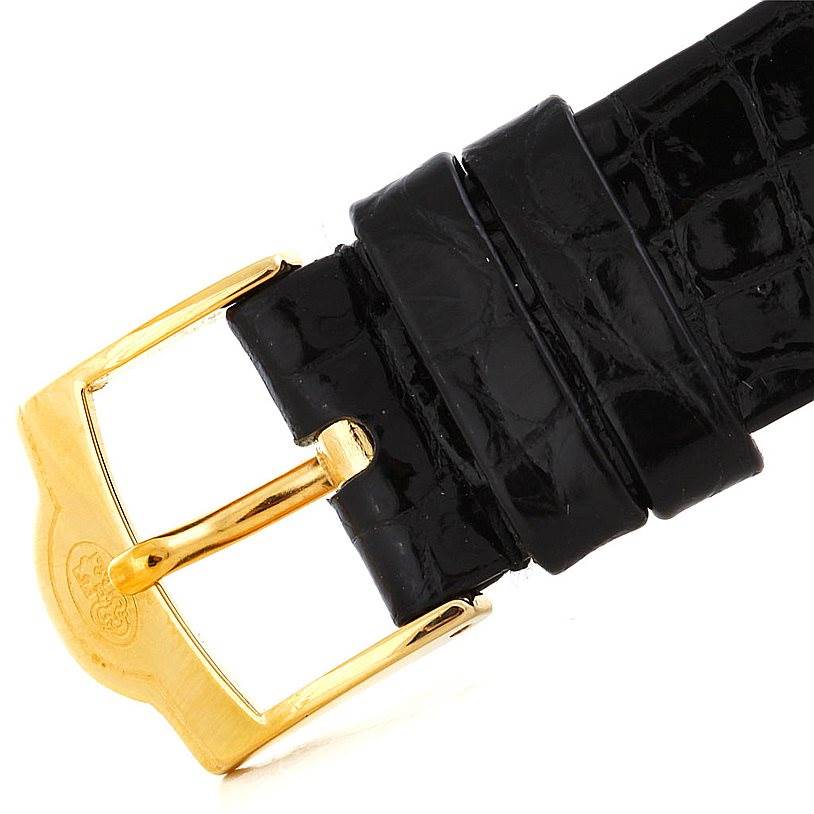 The image shows a close-up of the black leather strap and gold buckle of the Corum Coin Watch Men's Yellow Gold Black Dial Men's Yellow Gold Black Dial model.